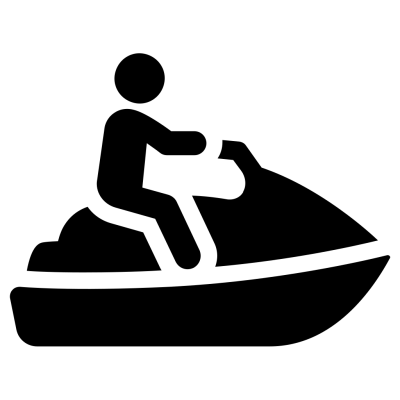 Silhouette of a person riding a jet ski.